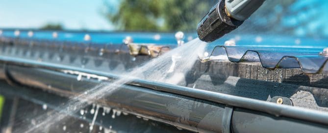 Gutters Cleaning Using Pressure Washer.