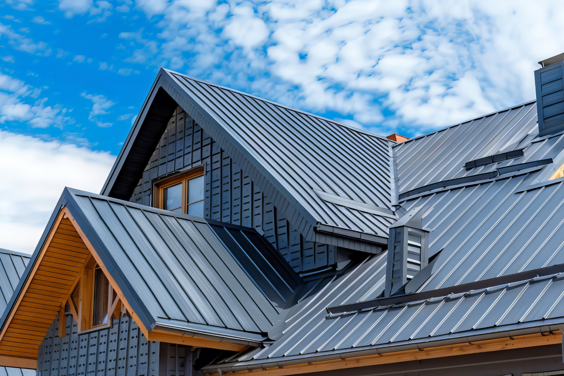 Modern blue-gray metal roof panels with clean architectural lines.