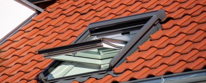 Skylight on shingle roof.