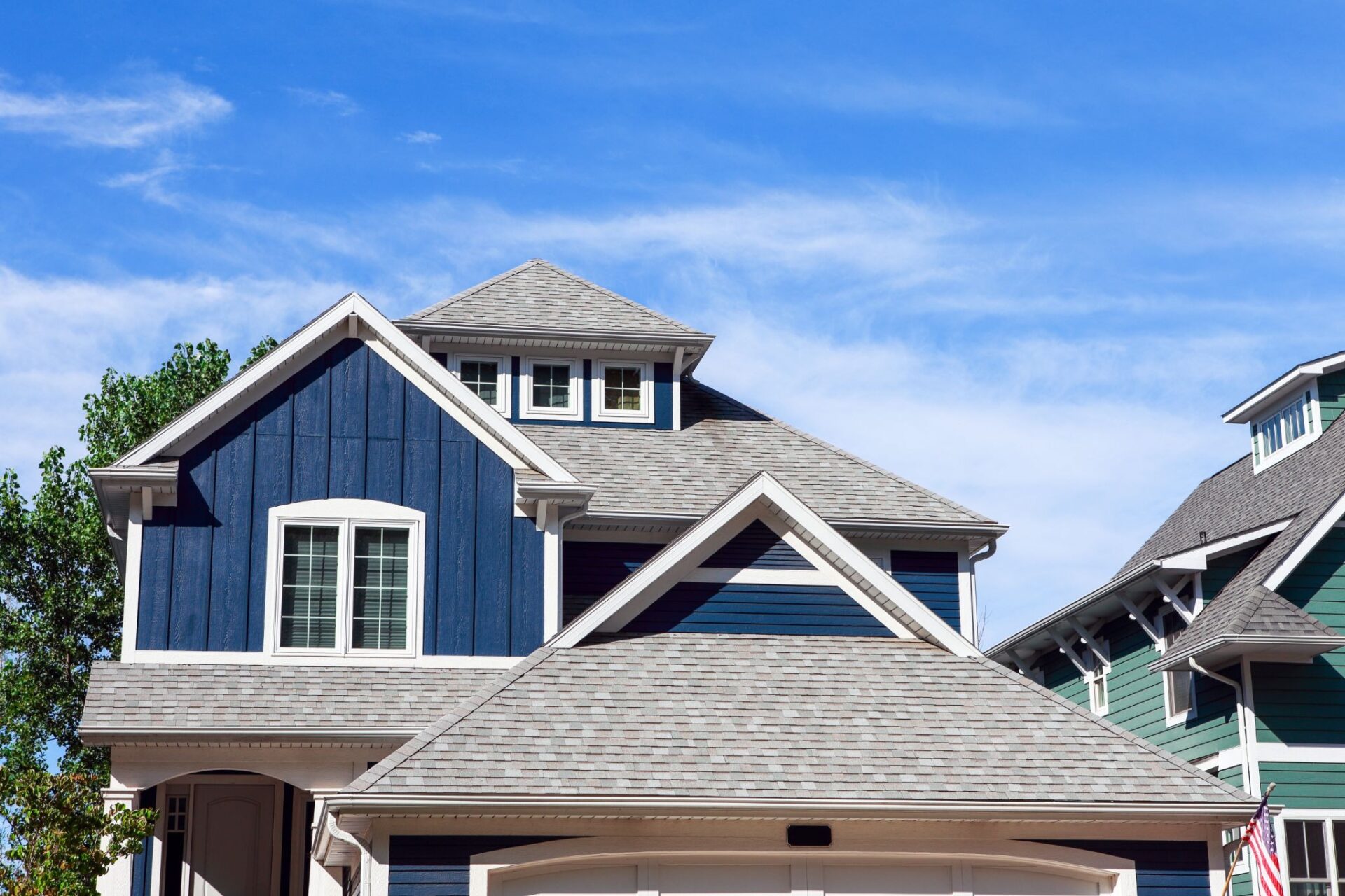 A house with blue siding and a sloped roof.